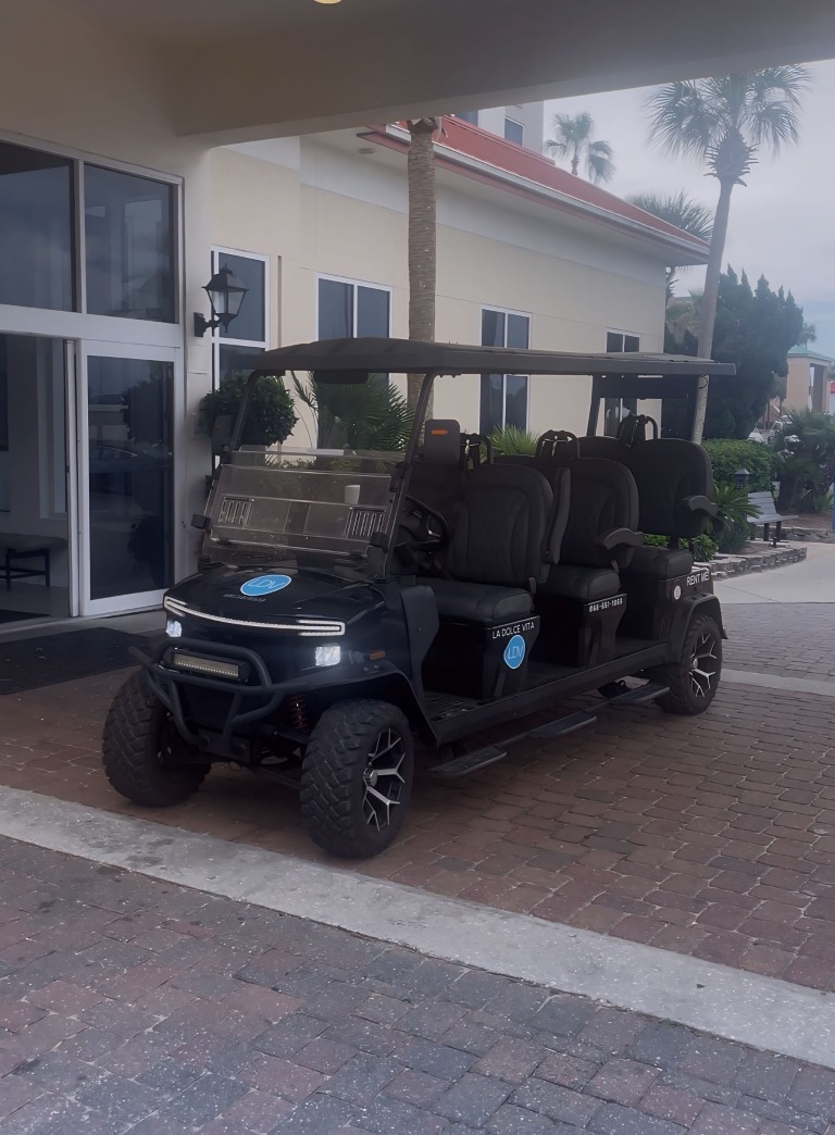 Two La Dolce Vita golf carts delivered at a Pensacola Beach rental home